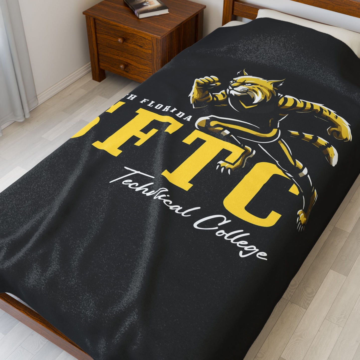 Black SFTC Velveteen Plush Blanket with Bobcat Design